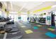 Bright gym featuring treadmills, weights and machines, complete with mirrors and colorful accents at 2560 Shanti Dr, Kissimmee, FL 34746