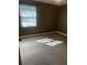 Empty bedroom with natural lighting from the window at 26 Palm Run, Ocala, FL 34472