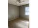 Gray painted bedroom featuring a ceiling fan and natural lighting at 26 Palm Run, Ocala, FL 34472