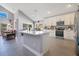 Modern kitchen with white cabinets, a large island, and an open floor plan at 2806 Baywood Ln, Kissimmee, FL 34746