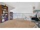 Loft area featuring neutral-colored carpet, white railing and shelving at 2806 Baywood Ln, Kissimmee, FL 34746