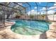 Sparkling pool featuring a beach entry, tiled floor, and a screened enclosure at 2806 Baywood Ln, Kissimmee, FL 34746