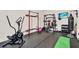 Well-equipped home gym featuring weight training equipment and exercise machines at 3245 Upland Pt, Oviedo, FL 32765