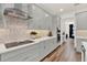 Stylish kitchen featuring grey cabinets, quartz countertops, and a decorative backsplash at 3245 Upland Pt, Oviedo, FL 32765