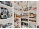 Organized walk-in pantry with abundant shelving for optimal storage space and a variety of modern appliances at 3245 Upland Pt, Oviedo, FL 32765