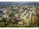 Aerial view of a neighborhood with mature trees and proximity to a lake or body of water at 328 Lake Fair Ln, Winter Park, FL 32789