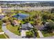 Overhead view of a home near a pond and busy highway at 328 Lake Fair Ln, Winter Park, FL 32789