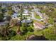 Beautiful aerial view of a residential neighborhood featuring mature trees and well-maintained lawns at 328 Lake Fair Ln, Winter Park, FL 32789