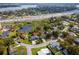 Aerial view of a home near a pond, highway, and commercial area at 328 Lake Fair Ln, Winter Park, FL 32789