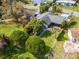 Aerial view of a house showing the layout of the backyard, wooden deck, and surrounding greenery at 328 Lake Fair Ln, Winter Park, FL 32789