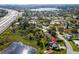 Aerial view of a residential area near a lake or pond, adjacent to a highway at 328 Lake Fair Ln, Winter Park, FL 32789