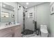 Updated bathroom featuring a tiled glass shower and stylish vanity with sink at 328 Lake Fair Ln, Winter Park, FL 32789