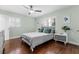 Cozy bedroom with hardwood floors, ample natural light, and neutral decor at 328 Lake Fair Ln, Winter Park, FL 32789