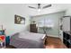 Bedroom featuring a ceiling fan, window with blinds, and traditional-style furniture at 328 Lake Fair Ln, Winter Park, FL 32789