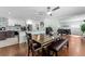 Bright dining area open to a modern kitchen with white cabinets and stainless steel appliances at 328 Lake Fair Ln, Winter Park, FL 32789