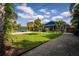 Lovely landscaped yard with palm trees leading up to this well maintained house at 328 Lake Fair Ln, Winter Park, FL 32789