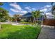 Landscaped front yard with lush green lawn and decorative white rock garden at 328 Lake Fair Ln, Winter Park, FL 32789