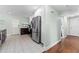 View of the kitchen showing stainless steel appliances, two-tone cabinets, and tiled flooring at 328 Lake Fair Ln, Winter Park, FL 32789