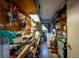 A compact storage room with cleaning supplies and shelving at 328 Lake Fair Ln, Winter Park, FL 32789