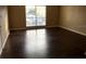 Bright bedroom with hardwood floors and large window offering natural light at 335 Wymore Rd # 201, Altamonte Springs, FL 32714