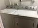 Laundry room with white washer and dryer units at 335 Wymore Rd # 201, Altamonte Springs, FL 32714