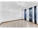 Bedroom with neutral paint, tile flooring, and curtains allowing for natural light at 3547 Medford Rd, Casselberry, FL 32707