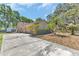 Charming single-story home with a driveway, lush landscaping, and mature trees at 3547 Medford Rd, Casselberry, FL 32707