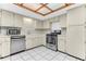 A functional kitchen features stainless steel appliances, ample cabinet space, and tile flooring for easy maintenance at 3547 Medford Rd, Casselberry, FL 32707