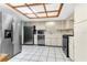 Traditional kitchen boasting stainless steel appliances, bright countertops, and a unique skylight, illuminating the space at 3547 Medford Rd, Casselberry, FL 32707