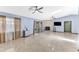 Bright living room featuring a stone fireplace, ceiling fans, and sliding doors to the outside at 3547 Medford Rd, Casselberry, FL 32707