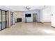 Spacious living room features tile floors, a brick fireplace and sliding glass doors for natural light at 3547 Medford Rd, Casselberry, FL 32707