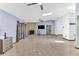 A bright and open living room with a stone fireplace, tile flooring, and modern ceiling fans for added comfort at 3547 Medford Rd, Casselberry, FL 32707