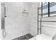 Modern tiled shower with a rainfall showerhead, built-in niche, and sleek fixtures at 3547 Medford Rd, Casselberry, FL 32707