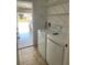 The laundry room features a washer and dryer and storage shelves; the garage entrance is visible at 415 Cinnamon Dr, Kissimmee, FL 34759