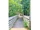 Scenic wooden boardwalk winding through lush greenery, perfect for relaxing strolls at 426 Club Dr, Winter Springs, FL 32708