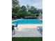 Community pool featuring lap lanes, lounge chairs, and patio area at 426 Club Dr, Winter Springs, FL 32708