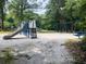 Community playground features slides, swings, and climbing structures, perfect for active children to explore and enjoy at 426 Club Dr, Winter Springs, FL 32708