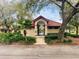 Community pool entrance featuring tropical palms and a covered seating area at 426 Club Dr, Winter Springs, FL 32708