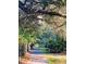 Tranquil walking path through a picturesque green community at 426 Club Dr, Winter Springs, FL 32708