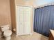 Bathroom featuring a toilet, tiled floors, closet and shower-tub combo at 4331 Willowcrest Ct, Orlando, FL 32826