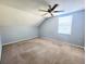 The angled bedroom has a ceiling fan and a large window at 4331 Willowcrest Ct, Orlando, FL 32826