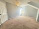 An angled bedroom with natural light and ventilation is offered by a large window at 4331 Willowcrest Ct, Orlando, FL 32826