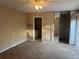 Bedroom with carpet, closet with sliding mirrored doors, and a view into the bathroom at 5286 Willow Ct # 505, Orlando, FL 32811