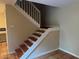 Staircase featuring tile treads, a white railing, and neutral-colored walls at 5286 Willow Ct # 505, Orlando, FL 32811