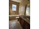 Bathroom showcasing a shower-tub combo, single sink vanity, and tile flooring at 602 Lochsmere Ln, Orlando, FL 32828