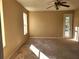 Bedroom with carpet, ceiling fan, and access to a private patio with pool views at 602 Lochsmere Ln, Orlando, FL 32828