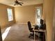 Bright bedroom featuring carpeted floors, a ceiling fan, and a door to an outdoor patio at 602 Lochsmere Ln, Orlando, FL 32828