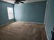 Bedroom with a ceiling fan and a window for natural lighting at 602 Lochsmere Ln, Orlando, FL 32828