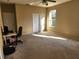 Spacious bedroom with carpet floors, a ceiling fan, and natural light from the window at 602 Lochsmere Ln, Orlando, FL 32828