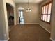 Open-concept dining room with a view of the kitchen and pool area at 602 Lochsmere Ln, Orlando, FL 32828